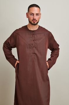 "Men Jubbah Thobe Full Sleeves          Our classic garments are designed with subtle element of contemporary elegance. Size         Length               Shoulder               Chest               Sleeve                 Inches/cm         Inches/cm            Inches/cm       Inches/cm   52            52\"/132 cm       17.5\"/43cm          22\"/57cm        23\"/59cm 54            54\"/137cm        18\"/45cm             23\"/59cm        23.5\"/60cm 56            56\"/142cm        18.5\"/47cm          24\"/62cm        24\"/62cm 58            58\"/147cm        19\"/48cm             25\"/64cm        25\"/64cm 60            60\"/152cm        19.5\"/50cm          26\"/66cm        26\"/66cm        Any Queries: If you have any queries please do not hesitate to contact us. Colours: Colours may slight Classic Long Sleeve Traditional Wear For Eid, Brown Long Sleeve Traditional Wear For Eid, Formal Long Sleeve Brown Kurta, Elegant Long Sleeve Brown Kurta, Saudi Style, Full Sleeves, Full Sleeve, T-shirt, Mens Outfits