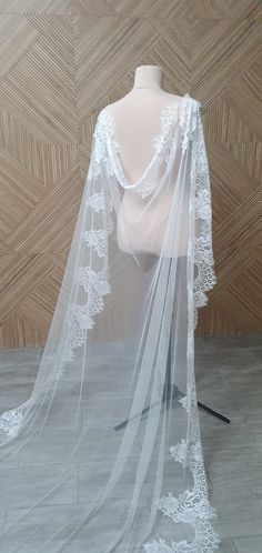 a white wedding veil on a mannequin