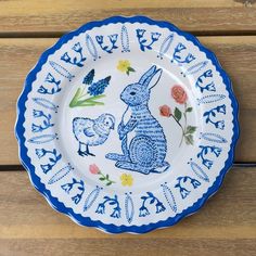 a blue and white plate with an image of a rabbit on it