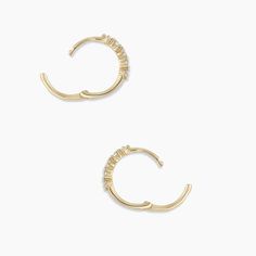 Description A cluster of diamonds various shapes creates a beautiful, eye-catching design on these 14k gold huggie hoop earrings. We love the way these earrings look in first piercings. Make it a single Product Details 1.29 total carat weight Ten 1.5 mm GI SI1- I1 diamonds 14k solid gold 12 mm profile diameter and 1.2 mm wide Hinge closure Yellow Gold Huggie Cartilage Earrings With Diamond Accents, White Gold Diamond Huggie Earrings Tarnish Resistant, 14k Gold Huggie Cartilage Earrings With Diamond Accents, Tarnish Resistant Huggie Diamond Earrings For Anniversary, Anniversary Tarnish-resistant Huggie Diamond Earrings, Yellow Gold Cubic Zirconia Huggie Earrings, Diamond Huggie Cartilage Earrings Fine Jewelry, Cubic Zirconia Huggie Earrings Prong Setting Everyday Luxury, Formal Diamond Huggie Earrings Tarnish Resistant