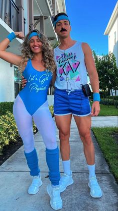 a man and woman are dressed up in bodysuits while posing for the camera