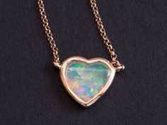 ♥ Heart-shape Solid Australian Crystal Opal Bezel Set Necklace 14K Rose Gold Pendant♥ Solid 14k rose gold pendant set with a beautiful -shaped ♥ Gorgeous  color!♥ The item measures 10.2 mm in length, 9.7 mm in width, and stands 2.9 mm thick
♥ Gemstone: ♥ All stone(s) used are genuine, earth-mined, and guaranteed conflict free! As is with anything that is naturally occurring, our gemstones or pearls will have imperfections, e.g. inclusions in the gemstones, unevenness in the pearl nacre.
♥ F 14k Rose Gold Heart Cut Jewelry, Rose Gold Pendant Set, Gold Pendant Set, Bezel Set Necklace, Crystal Opal, Rose Gold Pendant, Set Necklace, Opal Crystal, Pendant Set