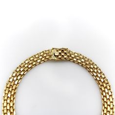 This is part of Chairish’s Fine Jewelry assortment.  This is a woven 18k gold bracelet with interlocking links. The exterior links consist of flattened chain links that interlock into rows for a fluid mesh-like effect that shimmers in the light. This classic Bismark design flows on the wrist like golden fabric.   The bracelet has a nice weight to it at 11.9 grams. It is 7 1/4” long and has a 1/4” width. It is marked with 750 with and M and contains an unidentified maker’s mark.   Circa 1980’s. Luxury Yellow Gold Chain Bracelet With Box Chain, Luxury Yellow Gold Box Chain Bracelet, Formal Yellow Gold Bracelet With Box Chain, Elegant Yellow Gold Jewelry With Interwoven Design, Luxury Wheat Chain Necklace, Formal Gold Bracelet With Wheat Chain, Luxury Gold Chain Link Bracelet For Formal Occasions, Luxury Gold Diamond Bracelet With Box Chain, Elegant Wheat Chain Bracelet For Formal Occasions