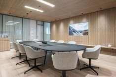 an empty conference room with chairs and a table