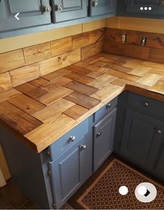 a kitchen counter made out of wooden planks