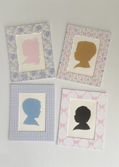 four framed silhouettes of women in different colors and sizes on a white surface with pink, blue, and yellow accents