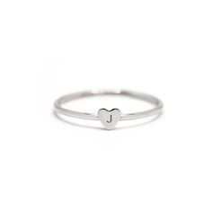 Engrave your own initial onto this very tiny heart ring. Made to order, ships out in 2-3 business days. Sterling Silver Laser Engraving Initial Height: 1.2mm Hypoallergenic, lead and nickel free Heart Height 3.5mm Band 1mm #R108 Jewelry Gift Guide, Engraved Initials, Moms Bracelet, Choker Pendant, Gold Statement Ring, Nose Jewelry, Tiny Studs, Engraved Bracelet, Red Gemstones