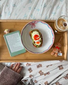 a tray with food and a book on it