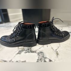 Black Leather Combat Boots Around The Ankle Is Suede Written Out Gucci On Suede Trim Lace Up Size Label 37 1/2 Made In Italy Black Leather Combat Boots, Gucci Boots, Leather Combat Boots, Size Label, Gucci Black, Gucci Shoes, Shoes Black, Black Shoes, Combat Boots