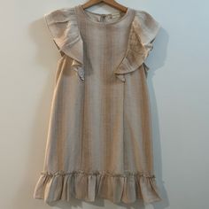 Nwot Hits A Palm Above The Knee For Me And I’m 5.2” So I’d Say This Is More Of A Mini Dress, Very Cute And Linen Like Material Beige Sleeveless Ruffle Dress For Summer, Beige Ruffled Short Sleeve Mini Dress, Beige Short Sleeve Mini Dress With Ruffles, Beige Mini Dress With Ruffles And Short Sleeves, Elegant Beige Sleeveless Dress With Ruffles, Beige Ruffle Sundress Sleeveless, Beige Sundress With Ruffle Hem, Beige Ruffle Hem Sundress, Cream Sleeveless Dress With Ruffle Hem