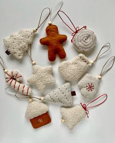 christmas ornaments are arranged on a white surface