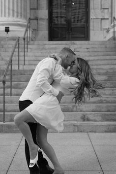 Editorial engagement photoshoot in downtown Tampa. The bride wears a short white bridal dress and the groom wears classic black pants and a white dress shirt Engagement Photoshoot Ideas Editorial, Short Wedding Dress Poses, Engagement Street Photography, Women Engagement Outfits, Engagement Photoshoot Ideas Charleston, Engagement Photo Elegant, Short Dress Wedding Photos, Italian Style Engagement Photos, Lauren Giraldo Engagement