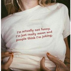 a woman wearing a t - shirt that says i'm actually not funny, i'm just really mean and people think i'm looking