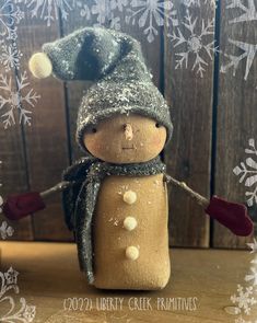 a snowman figurine wearing a hat and scarf