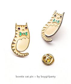 Cute Cat Enamel Pin Brooch by boygirlparty* This cat pin can be worn on your lapel or backpack* Pictures a unique illustration of a tabby cat in a bowtie by artist Susie Ghahremani* Trendy and cute, a wearable gift for both men and women* Find more cute pins at http://boygirlparty.etsy.comYou will receive this enamel pin featuring a unique drawing of a cat wearing a bowtie by Susie Ghahremani / boygirlparty.comMade of iron with a brass finish and four colors of enamel, this pin measures approxim Jewelry Kawaii, Chat Kawaii, Hipster Cat, Cat Enamel Pin, Cat Lady Gift, Pin Cute, Cat Bow Tie, Pin Enamel, Gifts Teacher