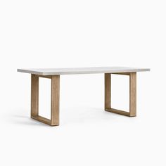 a white table sitting on top of a wooden frame