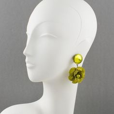 Charming dimensional dangling clip-on earrings designed by Cilea Paris for French Jewelry designer Francoise Montague. Floral-inspired hand-made artisanal resin earrings featuring poppy flowers with textured patterns built together to form a powerful statement piece. Very nice vivid green olive color. Unsigned like all the original Francoise Montague resin jewelry. Measurements: 2.75 in high (7 cm) x 1.63 in wide (4.1 cm).  Please see the measurements noted above in the description for the best French Jewelry, Olive Color, Poppy Flower, Resin Jewelry, Designer Earrings, Olive Green, Clip On Earrings, Poppies, Jewelry Design