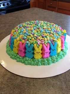 a cake decorated with peeps on top of a counter