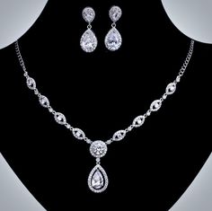 A beautiful two-piece bridal jewelry set with an incredible sparkle! Adorned with intricately faceted cubic zirconia that capture the light from every angle with a perfectly translucent appeal, the pieces are platinum plated for a flawless finish which enhances the intricate detailing and conveys a modern take on old elegance. Necklace: 18" (approx. 46cm) long with a lobster clasp and a 2" extension (if a longer length is needed, please leave a note with your desired length at checkout). Earring Beautiful Wedding Jewelry, Crystal Bridal Jewelry Sets, Bride Necklace, Navel Jewelry, Bridal Fashion Jewelry, Tiffany Jewelry, Bridesmaid Jewelry Sets, Wedding Accessories Jewelry, Silver Jewellery Sets