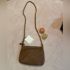 This Small Calvin Klein Crossbody Is So Cute And Brand New!! A Brown Color That Goes Well With Anything. 100% Leather Closure Type - Zipper Lining - Polyester Pockets: 1 Interior Slip, 1 Interior Zip Pebble Leather Crossbody Bag Width 8.5 Inch 6 Inch Height 2.6 Inch Depth 23 Inch Strap Drop Calvin Klein Bags, Chestnut Leather, Calvin Klein Bag, Black Bucket, Vintage Calvin Klein, Brown Purses, Black Crossbody, Small Crossbody Bag, Black Cross Body Bag