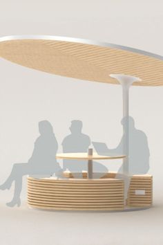 two people are sitting at a table under a large white umbrella that is shaped like a boat