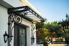 the front entrance to a home with wrought iron work