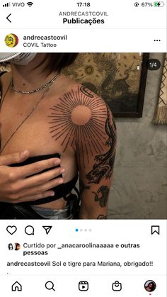 a woman with tattoos on her chest and arm