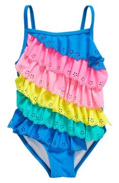 Your kiddo will love every pool day splashing around in this cute one-piece swimsuit featuring rainbow-colored ruffles with eyelet and scalloped details. Pull-on style Lined 82% nylon, 18% elastane Machine wash, line dry Imported Playful Ruffled Swimwear For Summer, Playful Pink Ruffled Swimwear, Playful Ruffled Swimwear For The Beach, Beach Season Ruffled Swimwear, Pink Ruffled Summer One-piece, Summer Swimwear With Ruffles, Playful Multicolor Swimwear With Ruffles, Playful Multicolor Ruffled Swimwear, Playful Ruffled Swimwear For The Pool