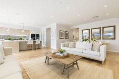 a living room filled with furniture and a wooden coffee table