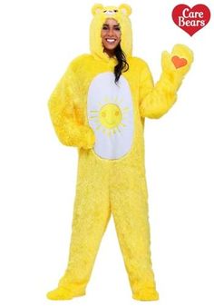 a woman in a yellow bear costume is smiling and holding her hand up to the side