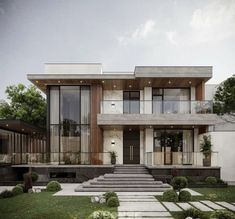 a modern house with steps leading up to the front door