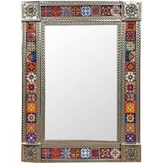 an ornate mirror with multicolored tiles on the frame and border around the edges