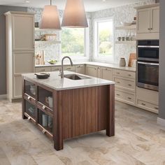 a kitchen with an island, sink and two hanging lights over it's windows