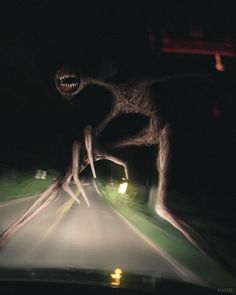 an alien is walking on the road at night