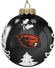 a black ornament with an orange and white football team on it's face