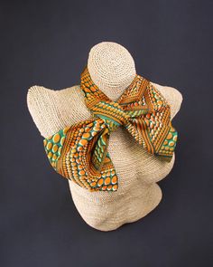 Introducing our African fabric neck scarf - a versatile and fashion-forward accessory that showcases cultural charm and allows you to express your unique style in multiple ways. Each scarf is handcrafted with authentic African fabric, featuring vibrant colors and patterns deeply rooted in African heritage. With meticulous attention to detail, we create each piece with care, ensuring a high-quality accessory that speaks to the richness of African artistry. Wear it as a neck scarf to elevate your Bohemian Multicolor Silk Scarf For Gift, Brown Bohemian Woven Scarf, Traditional Handmade Multicolor Scarves, Patterned Bohemian Scarves For Gift, Bohemian Multicolor Silk Scarf For Festivals, Bohemian Patterned Scarves For Gifts, Bohemian Patterned Scarves As Gift, Multicolor Silk Scarf With Traditional Patterns, Multicolor Silk Shawl For Festival