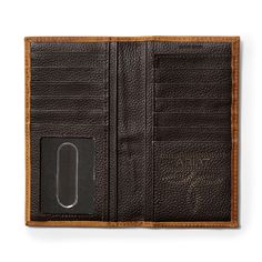 This rugged, rodeo-style wallet makes it easy to stay organized. Featuring distinctive, debossed logo detailing, it neatly stores your credit cards, cash and ID. \r\n\r\nRodeo style wallet with debossed Ariat detailing\r\nCredit card slots\r\nClear ID window\r\nRemovable photo slip\r\nCash compartment\r\nMeasures: 6 1/2 x 3 1/2\r\n\r\nRodeo Wallet Large Logo | Men's Rodeo Wallet Large Logo in Medium Brown, Size: OS by Ariat Leather Roper Wallet, Ariat Mens Wallets, Rustic Brown Wallets With Card Slots, Artisan Brown Wallet With Interior Card Slots, Brown Wallets With Interior Card Slots For On-the-go, Rodeo Fashion, Medium Brown, Staying Organized, Card Slots