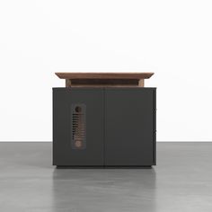 a black cabinet with a wooden table top