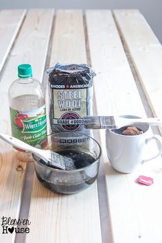 ingredients to make an apple pie sitting on a wooden table with a measuring cup and spoon