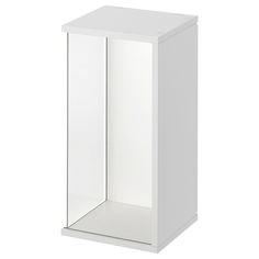 a white cabinet with doors and shelves on the front is shown in an angled view