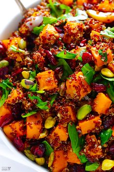 a white bowl filled with lots of food