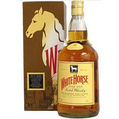 a bottle of white horse whisky next to a box