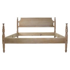 a wooden bed frame with two posts on each side