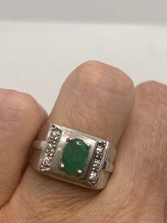 Simple vintage genuine emerald ring rich and very bright green Emerald Sterling silver Size 7 can be sized by my jeweler. His service charge is $10-$20 All rings are shipped in a nice gift box. Check out our over a THOUSAND great reviews Engraving is $4 per letter and is not always perfect depending on the piece. It can take a few days if the jeweler is busy. This is payable to Paypal Judithsltd@gmail.com Vintage Green Sterling Silver Signet Ring, Classic Green Emerald Ring For Collectors, Classic Green Signet Ring For Anniversary, Green Classic Signet Ring For Anniversary, Emerald Ring With Vs Clarity For Gift, Emerald Ring With Vs Clarity As Gift, Fine Jewelry Green Signet Ring With 17 Jewels, Formal Green Emerald Signet Ring, Green Gemstone Signet Ring As Gift