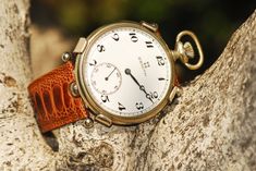 "A beautiful time piece, a classic Zenith pocket watch converted by Revenant Watches Stainless steel classic case, watch is approximately 48mm diameter. Weight is 179.9g Carrier is 316l stainless steel, with 0.925 silver retaining arms Brown Ostrich leather strap with a polished stainless steel quick release buckle. Watch keeps good time, is tested. A completely unique timepiece. Contained within a handmade solid walnut case with red satin finish All watches are certified by Revenant Watches Eac Timeless Pocket Watch With Skeleton Dial, Luxury Automatic Pocket Watch For Formal Occasions, Luxury Pocket Watch With Polished Finish, Luxury Automatic Pocket Watch With Round Dial, Luxury Automatic Pocket Watch, The Revenant, Ostrich Leather, Pocket Watches, Quick Release Buckle