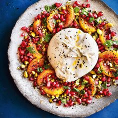 a white plate topped with food on top of a blue table