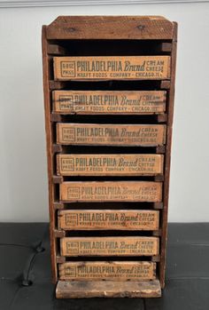 an old wooden box with six different types of pizza boxes on it's sides