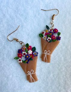 Handmade bouquet earrings with multicolored flowers and leaves. Completed with golden hardware Handmade Bouquet, Multicolored Flowers, Handmade Bouquets, Dangling Earrings, Flowers And Leaves, Brooklyn, Jewelry Earrings Dangle, Etsy Earrings, Dangle Drop Earrings