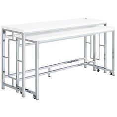 two white tables sitting next to each other on top of metal wheels and casteors