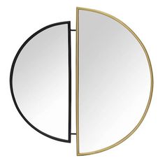 an oval mirror with a black and gold frame